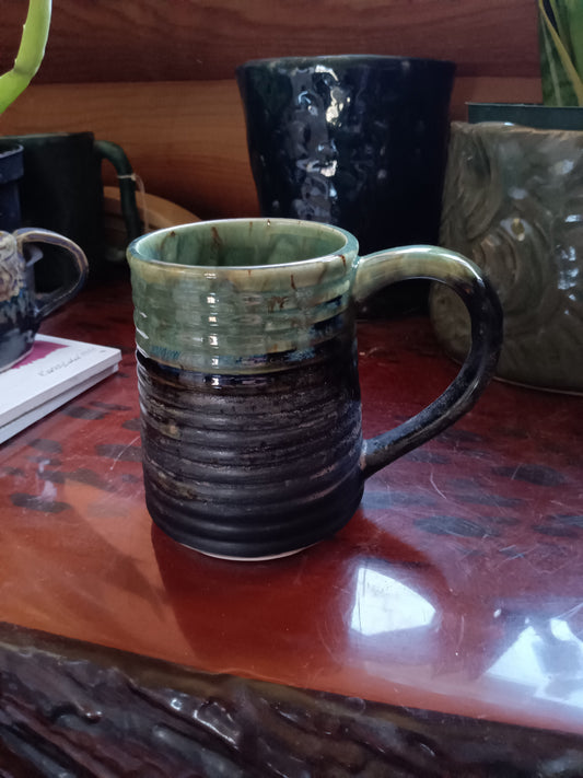 Green and black matte ribbed mug